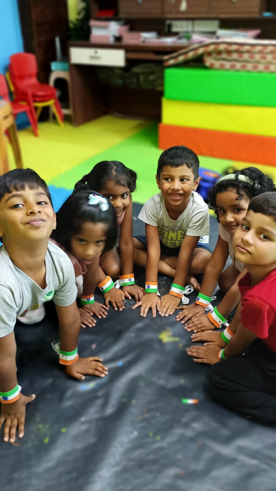 Students displaying handmade Indian festival greeting cards