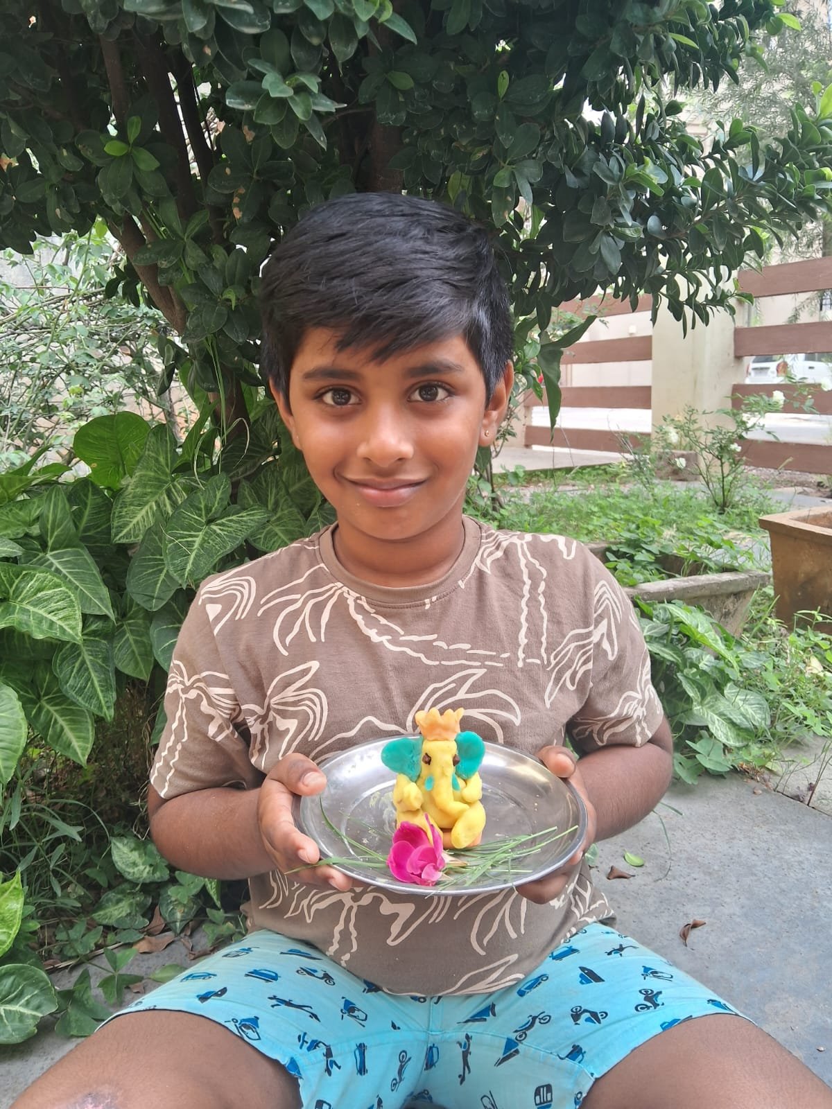 Children creating folk art motifs inspired by Indian wildlife and nature